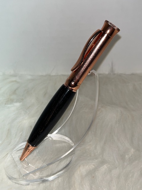 This is a PKM-4 Gunmetal Rosegold Ballpoint Twist Pen Kit featuring Beautiful Gaboon Ebony Wood with a C/A finish. Verfy nice pen kit that was easy to make. Highly recommend.