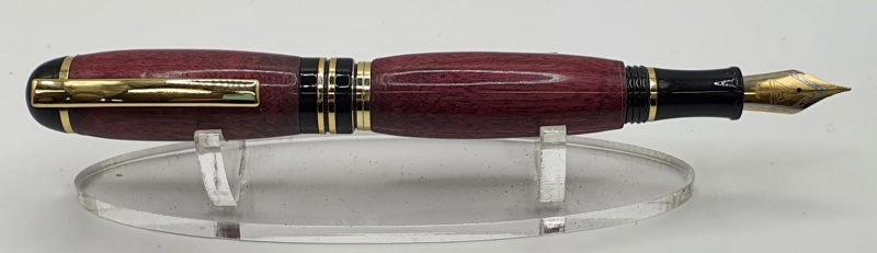 Great Churchill pen kits one is beeswax polished the other is CA Glue finish..not sure on woods