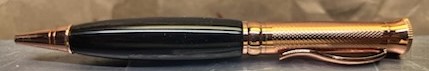 This is a PKM-4 Gunmetal Rosegold Ballpoint Twist Pen Kit featuring Beautiful Gaboon Ebony Wood with a C/A finish. Verfy nice pen kit that was easy to make. Highly recommend.