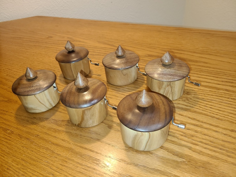 Oak, Walnut, and Meranti, each with a Kimiwo Nosete music box movement. My kids couldn't believe I had made them myself. The movements themselves feel well-made, and survived repeated mishandling as I tried to figure out how to make a lathe-turned box for them.